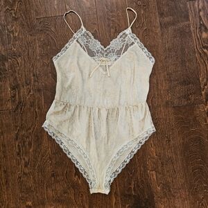 Elegant Cream Lace Trimmed Women's Bodysuit